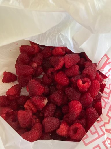 fresh raspberries in paper
